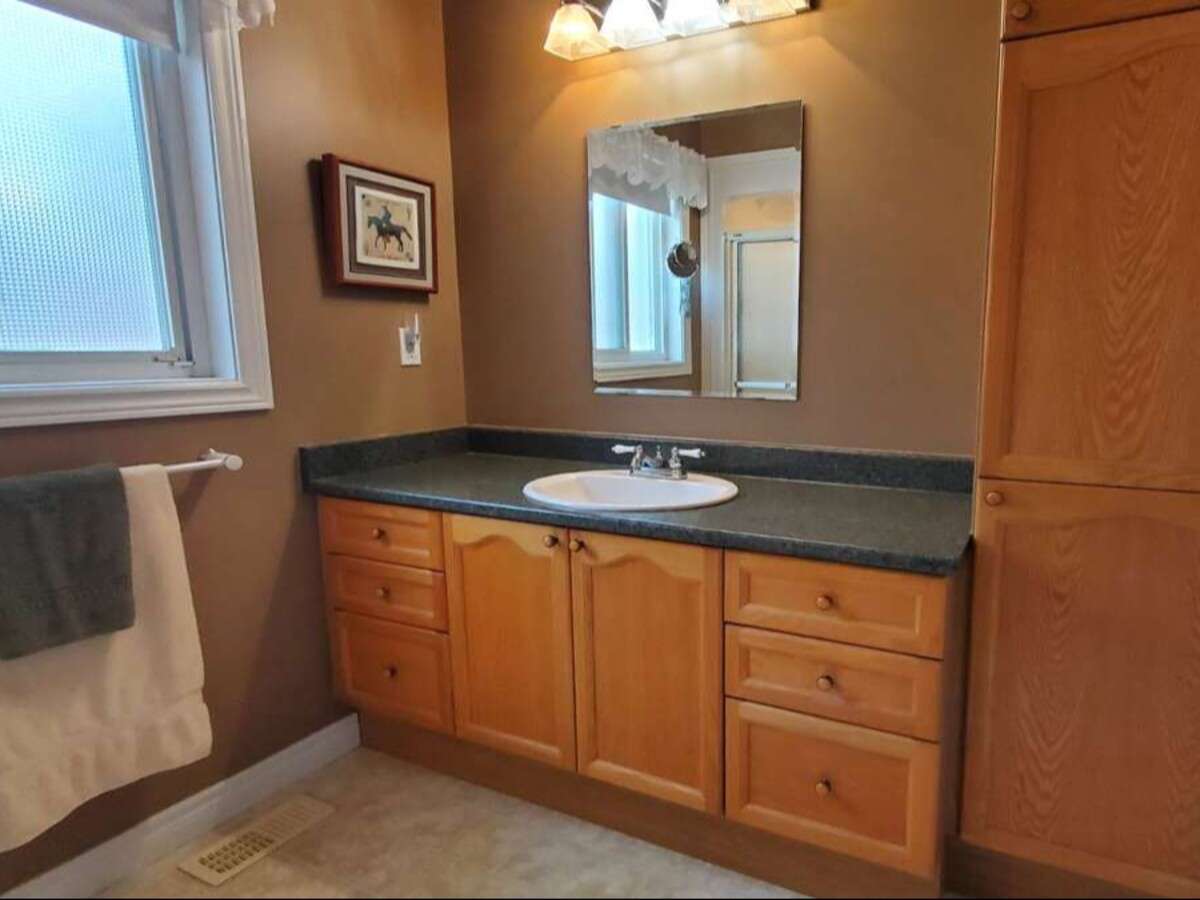 Privacy, Lake Views, & 3,000 sqft. Refined Living!