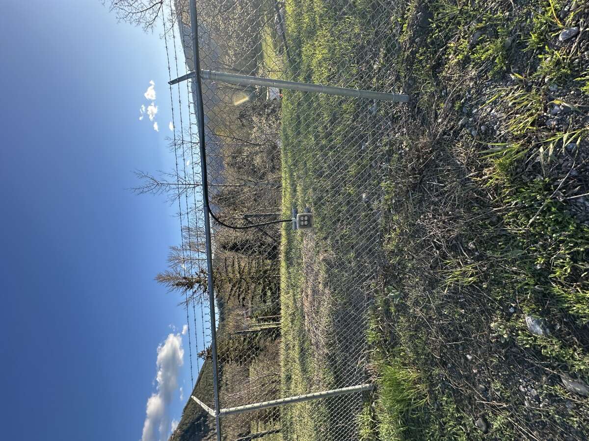 Plug in for vehicles along fence line