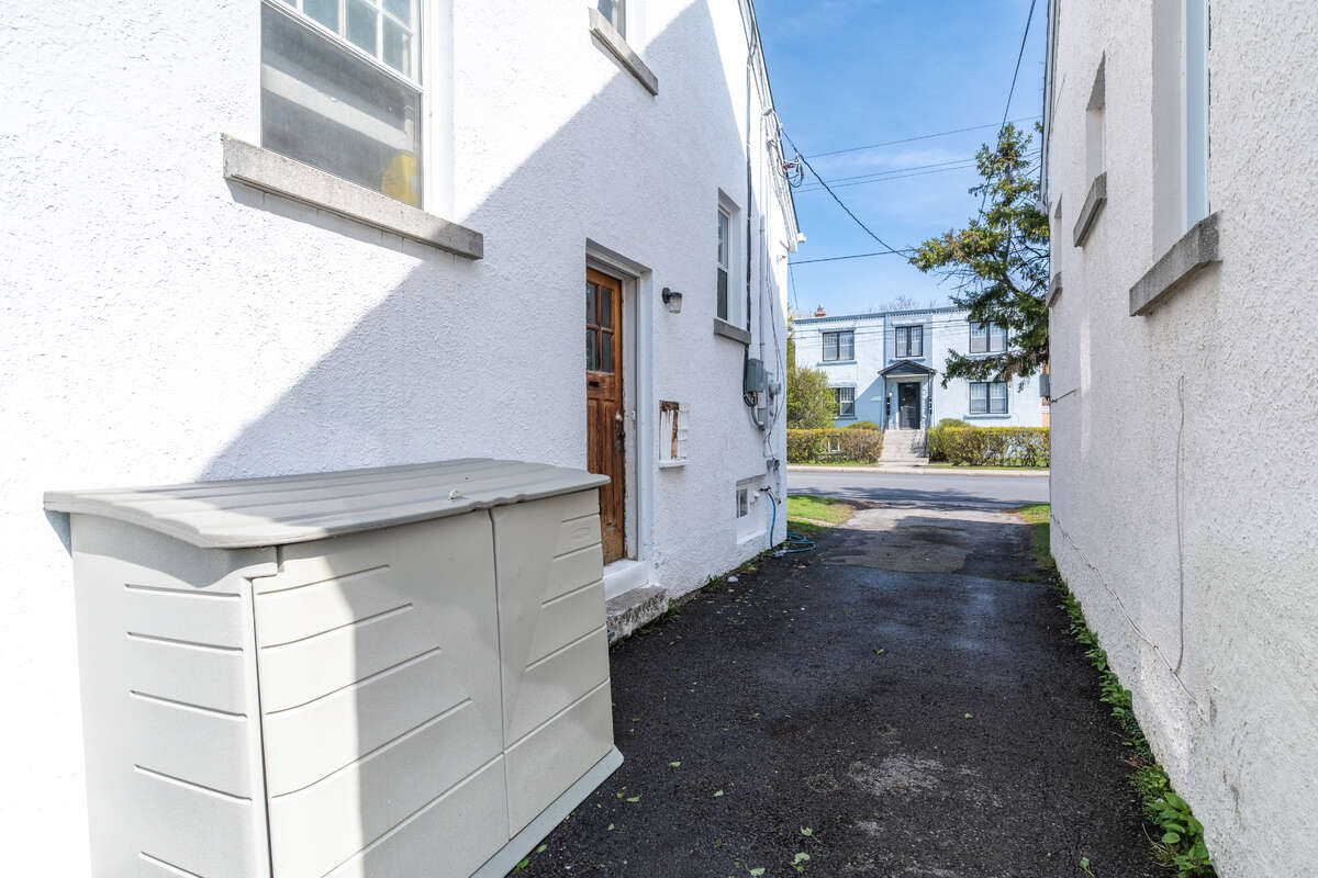Side of house with driveway for parking