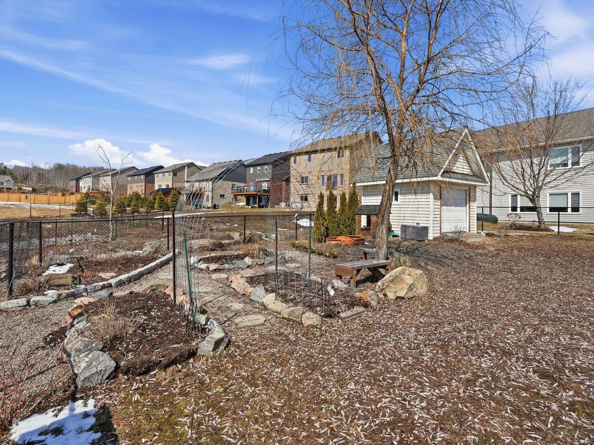 Three raised bed and corner perennial pollinator garden