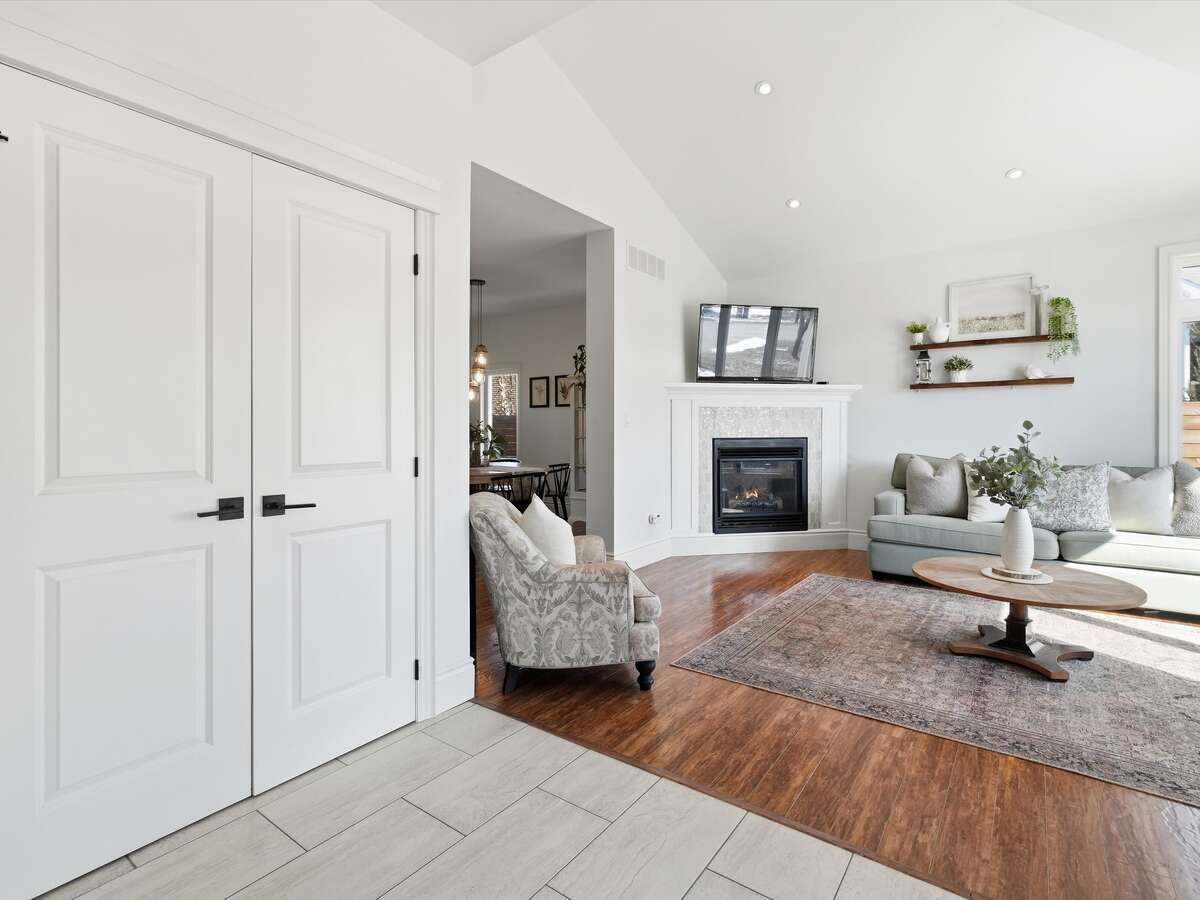 Foyer into living room with vaulted ceiling