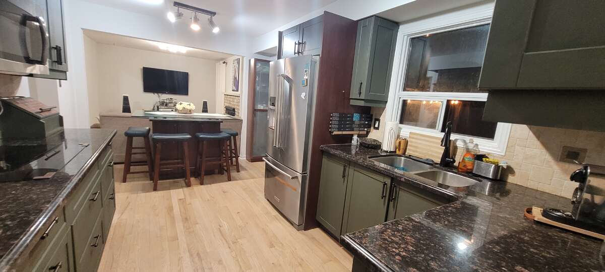 Large kitchen with lots of counter granite counter space