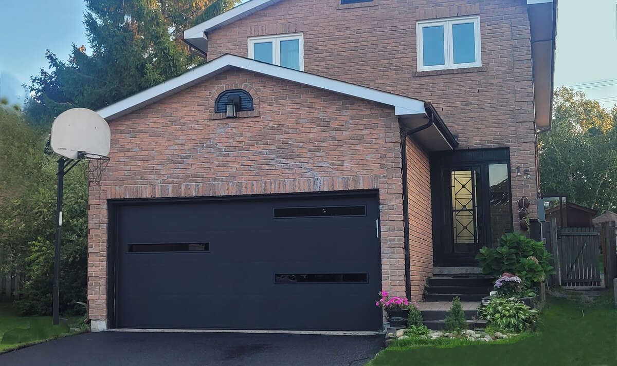 New Gaage door, and newly coated driveway