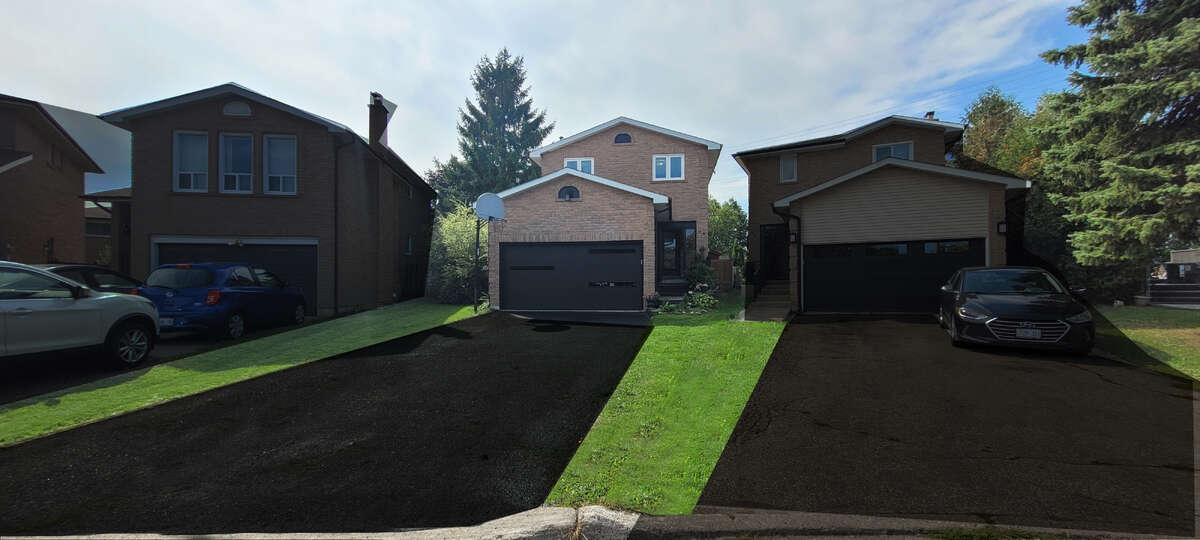 New Gaage door, and newly coated driveway