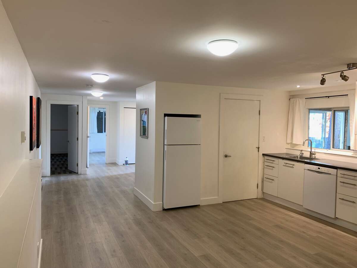 Lower level suite, looking south past the kitchen area to the 2 bedrooms and entry area.