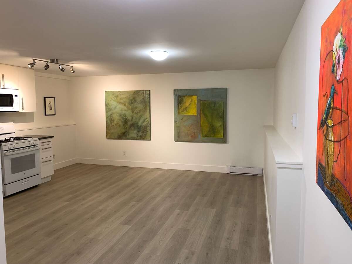 Lower level great room, incl. kitchen, living and dining areas.