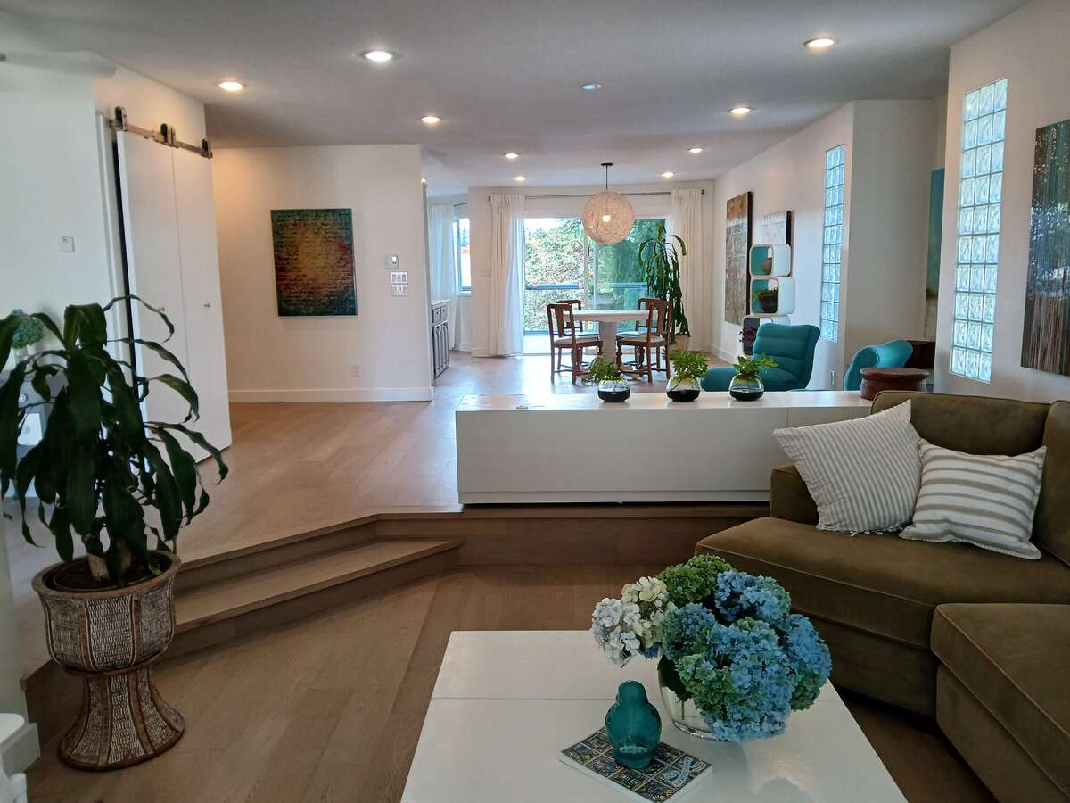 Looking from sunken living room towards open space (great room) and then dining room.