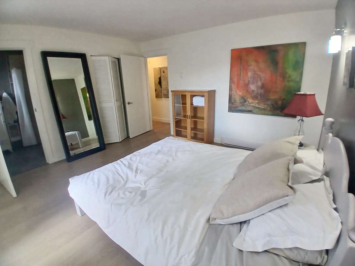 Primary bedroom, with walk-in closet by entry door