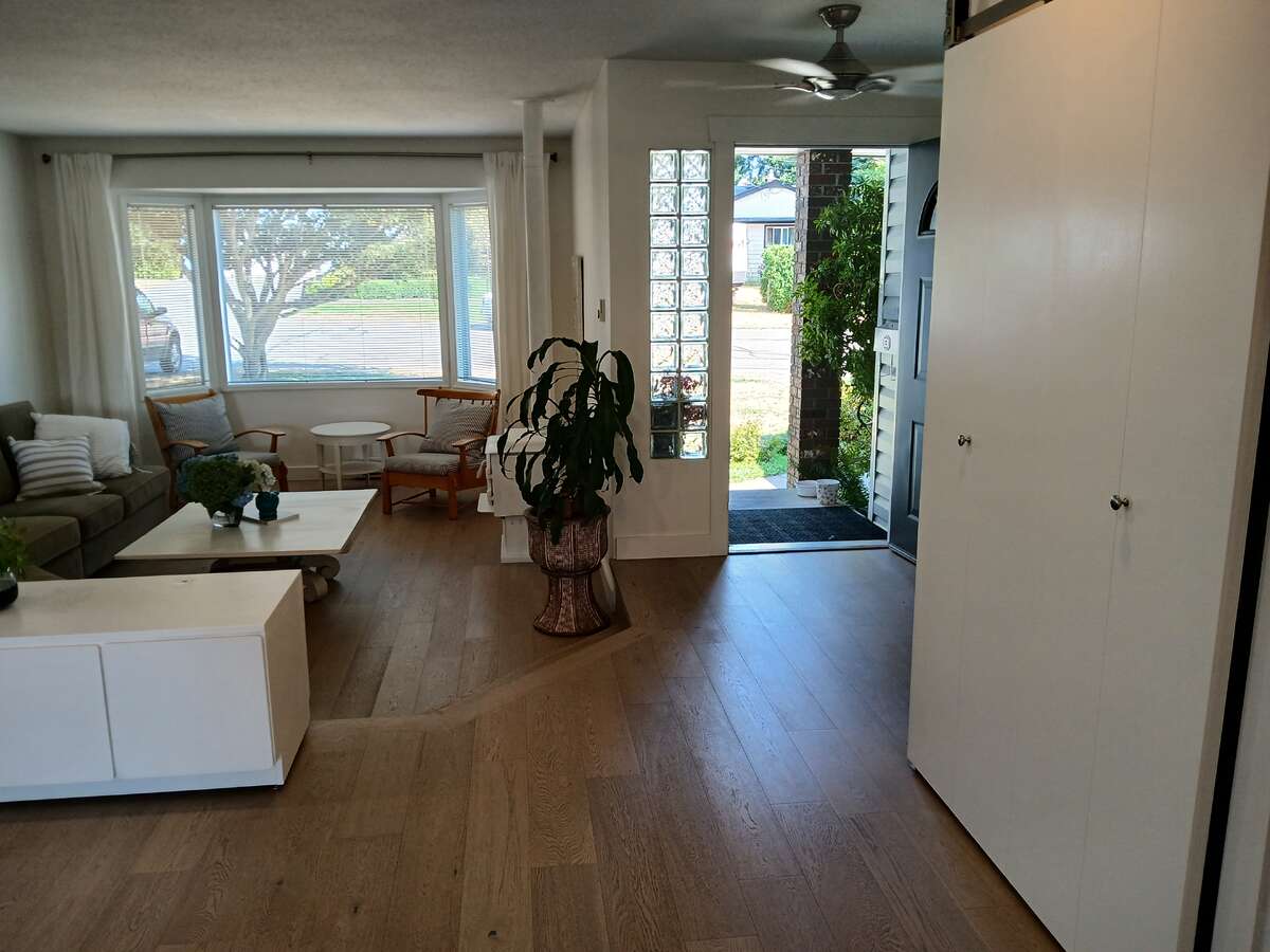 Looking back to front door and sunken living room.