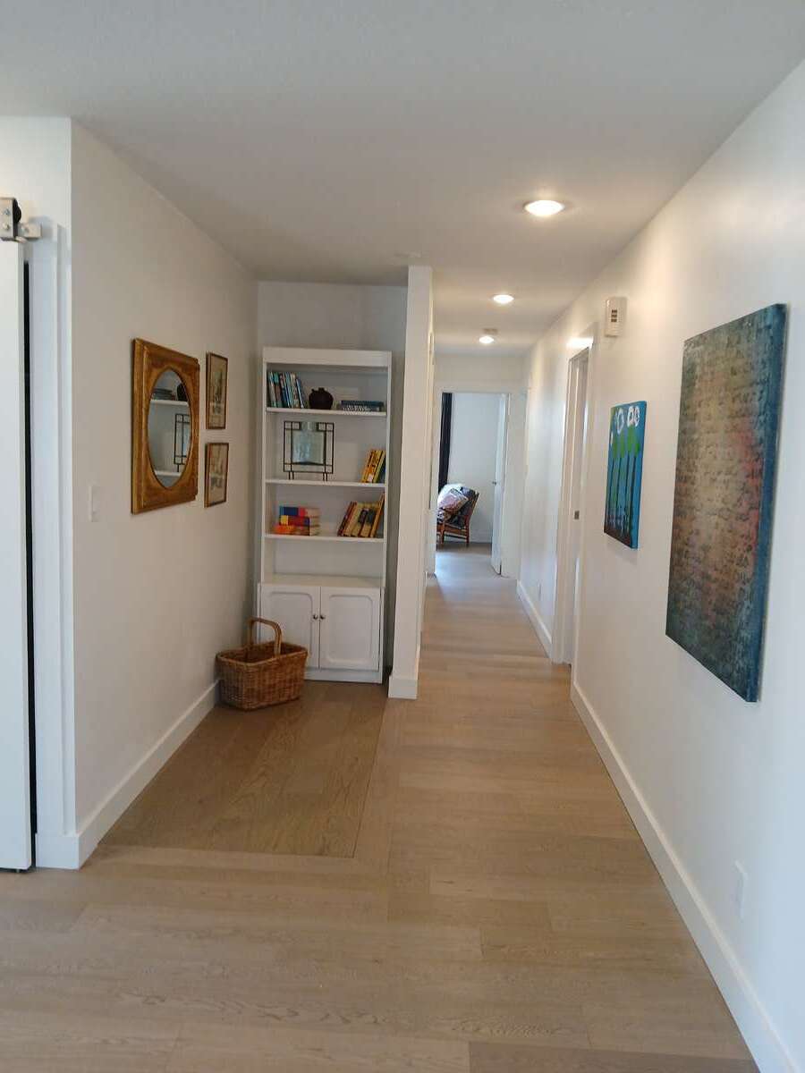 Hallway to upper level bedrooms and bathrooms