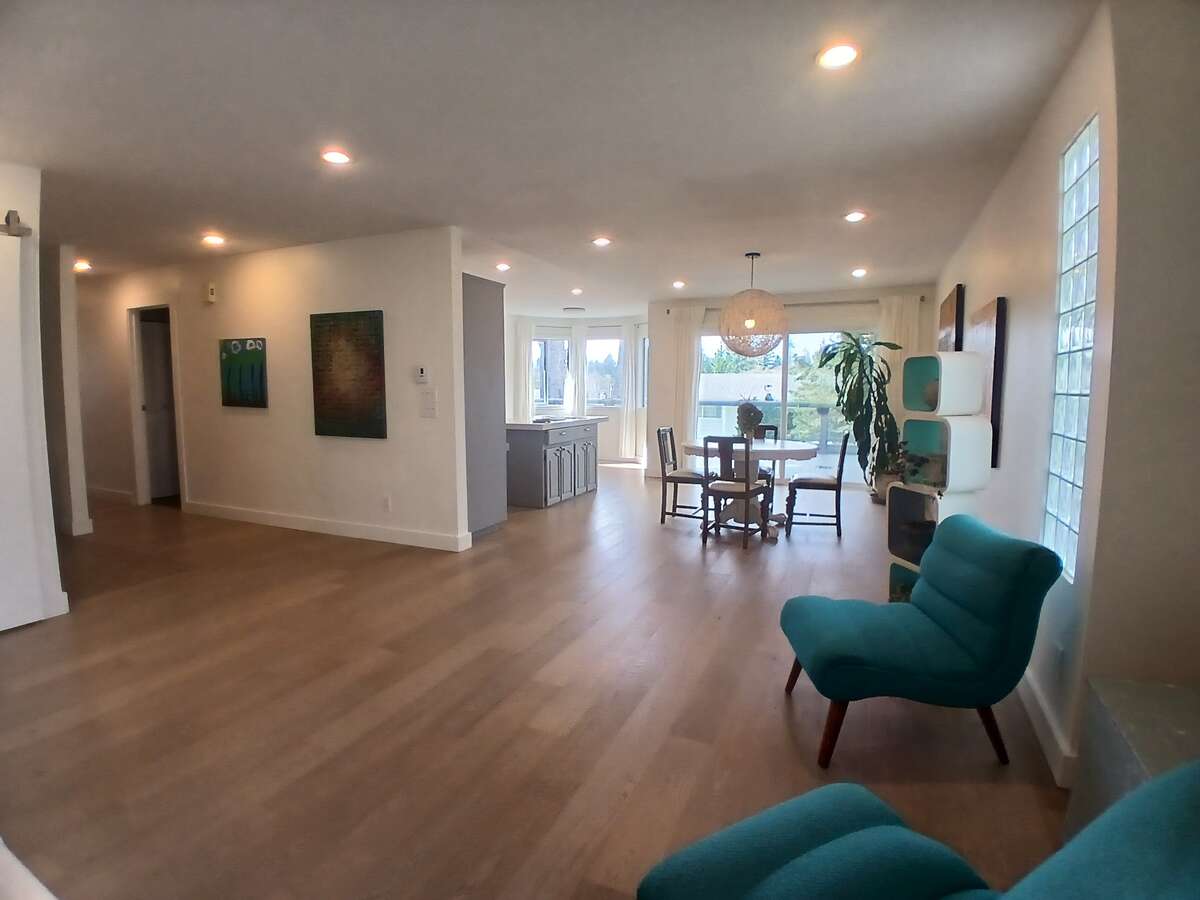 Family room, with dining room (right) and hallway (left)