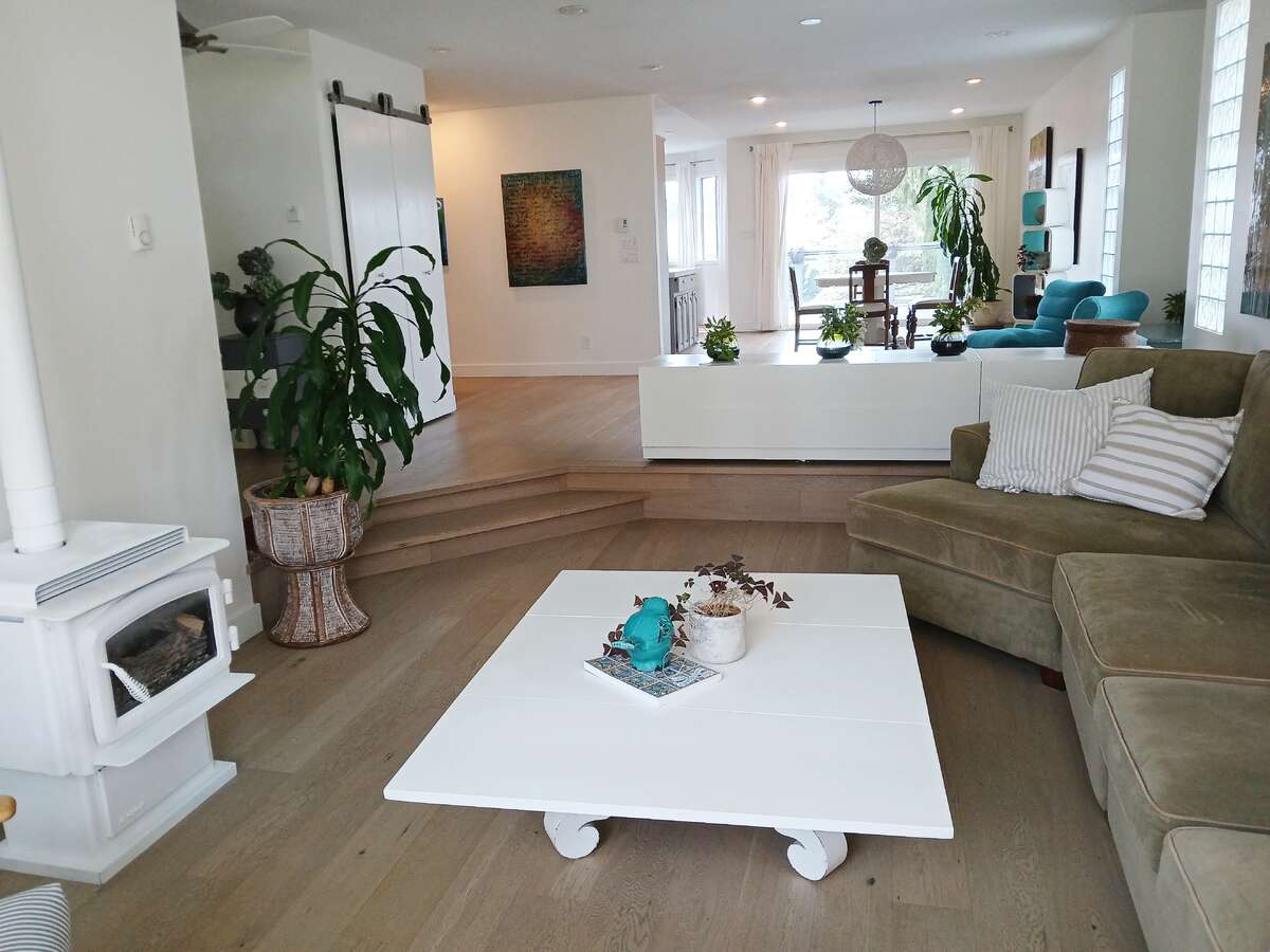 Looking west from living room towards family room, dining room and kitchen
