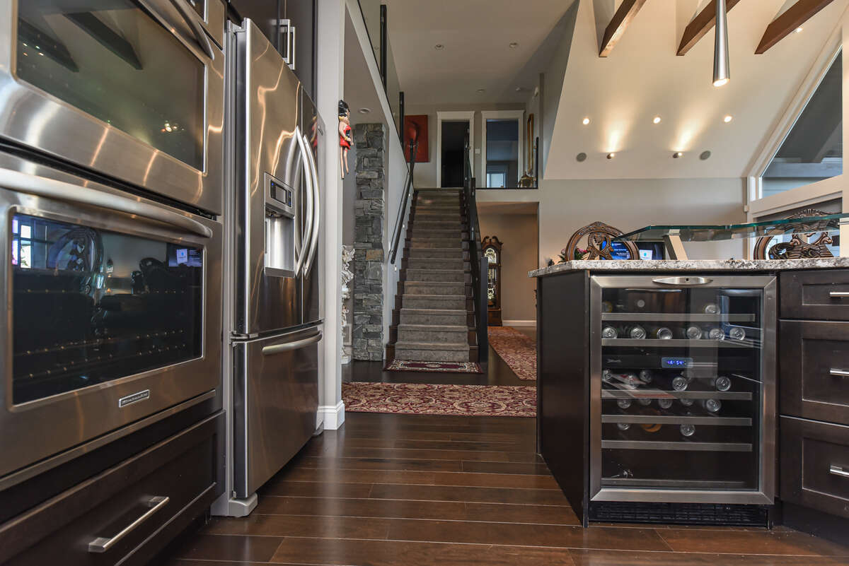 Kitchen View to Stairs up to 2nd Level Mezzanine
