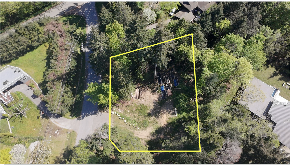 Property boundaries shown—0.5-acre lot with cleared build area