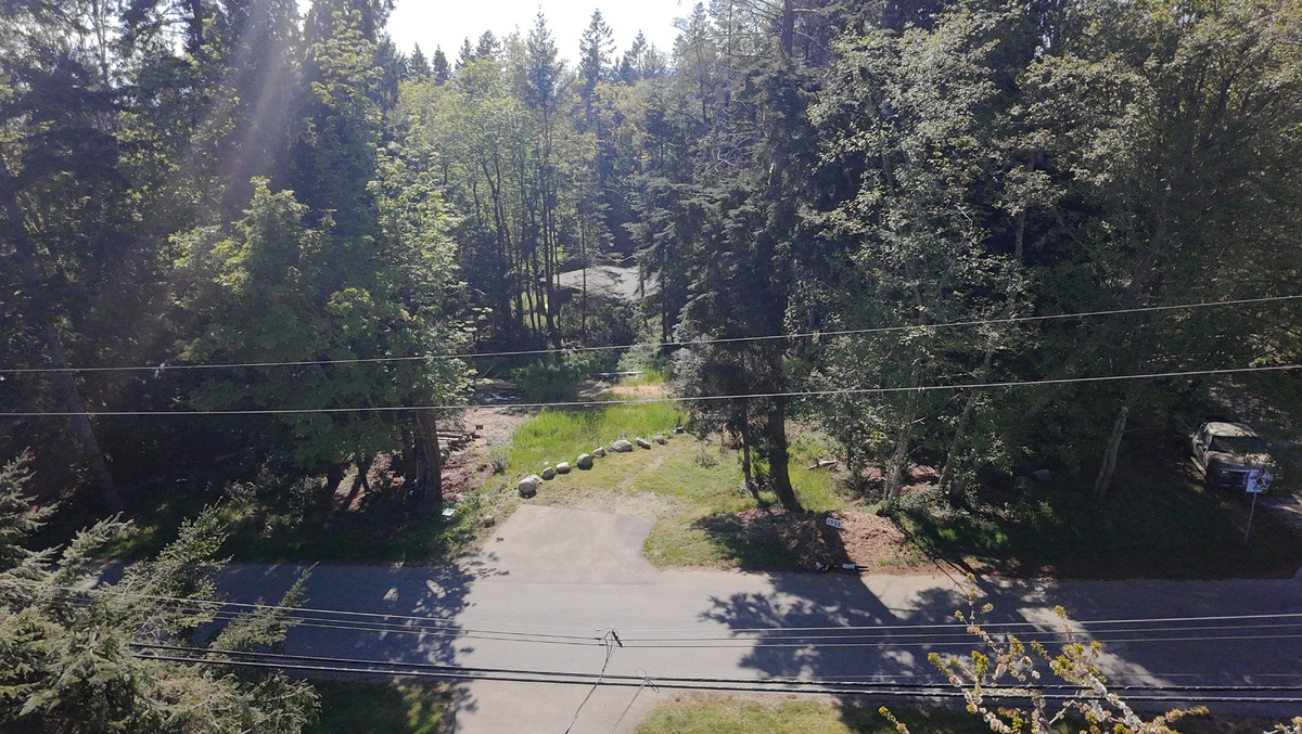Generous half-acre footprint with flexible building options.