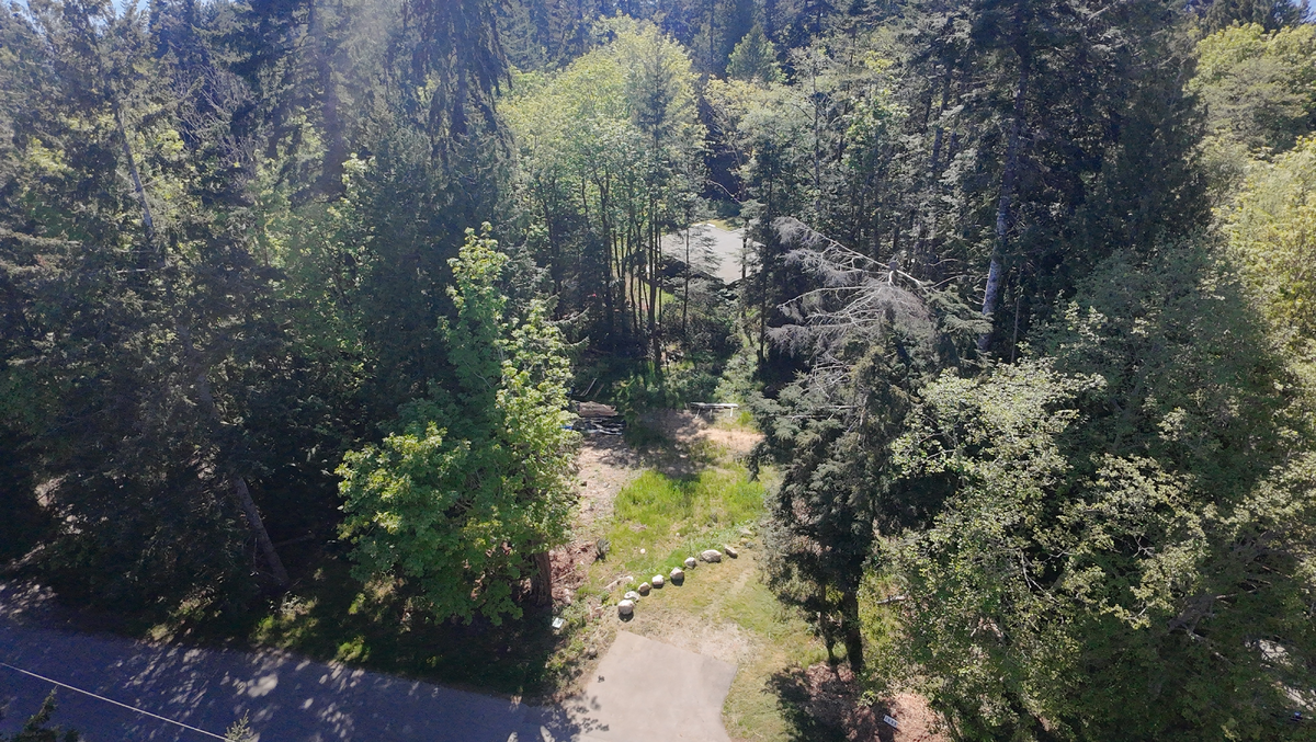 0.5-acre lot surrounded by mature trees for natural privacy