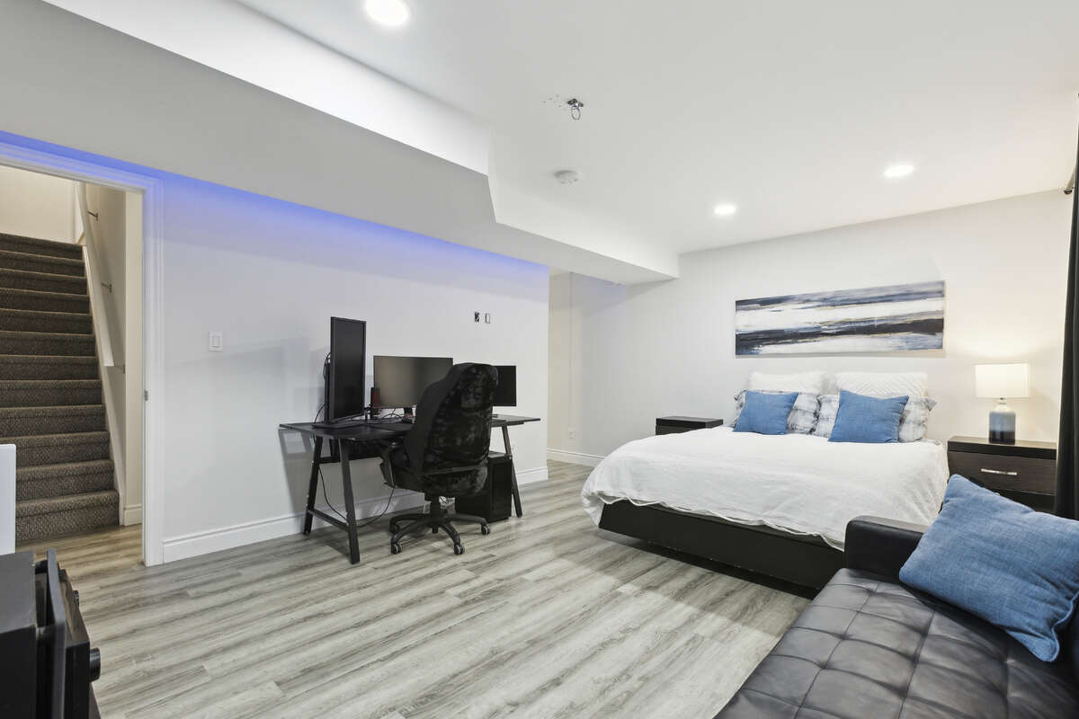 New finished basement with portlights and luxury vinyl planks