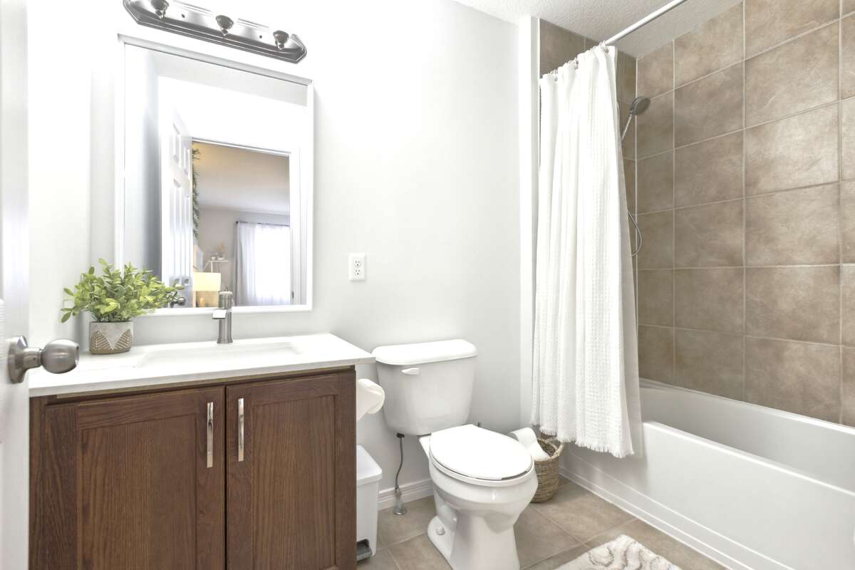 Master ensuite with tub and ceramic tiles