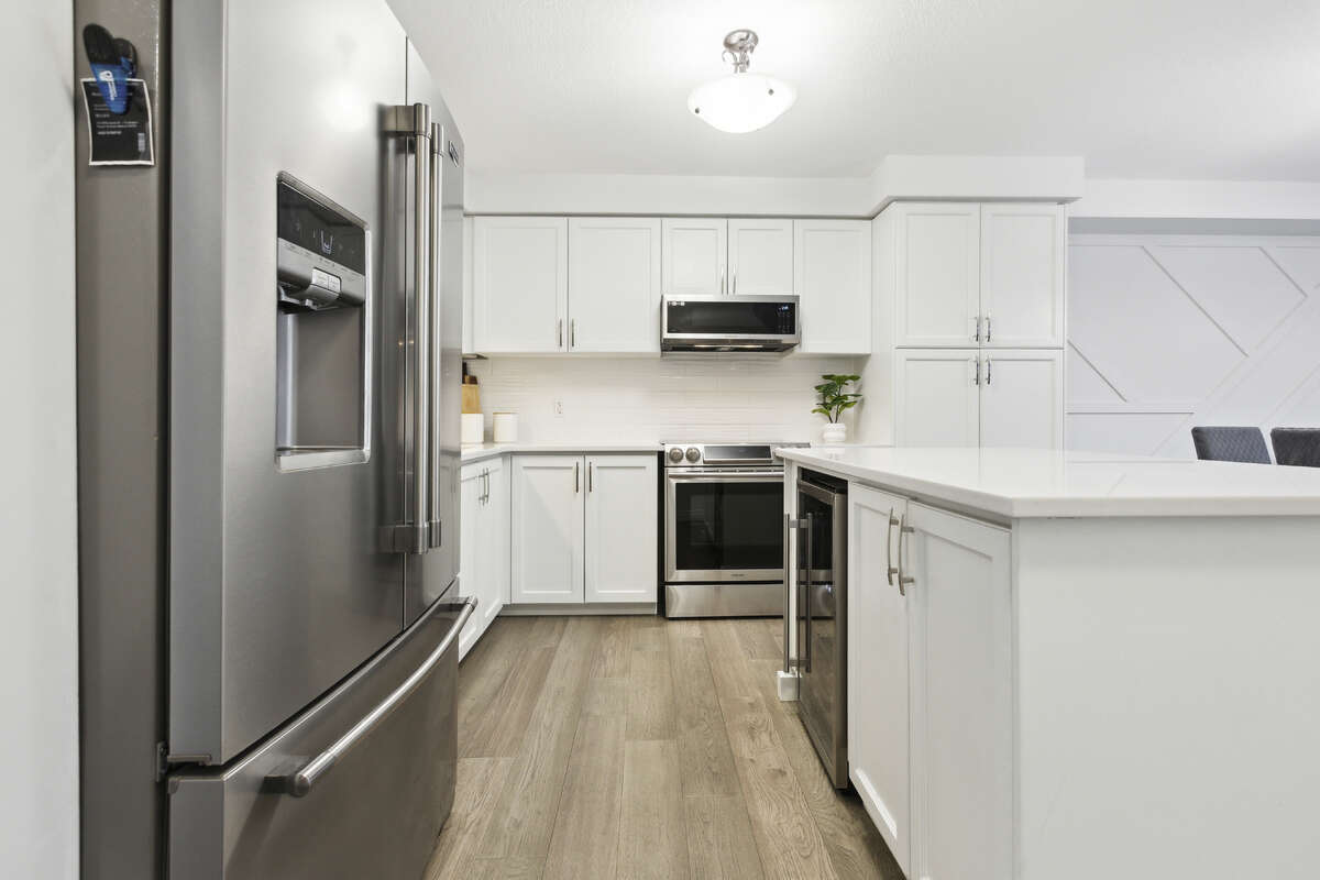 Large island, bar fridge, added pantry