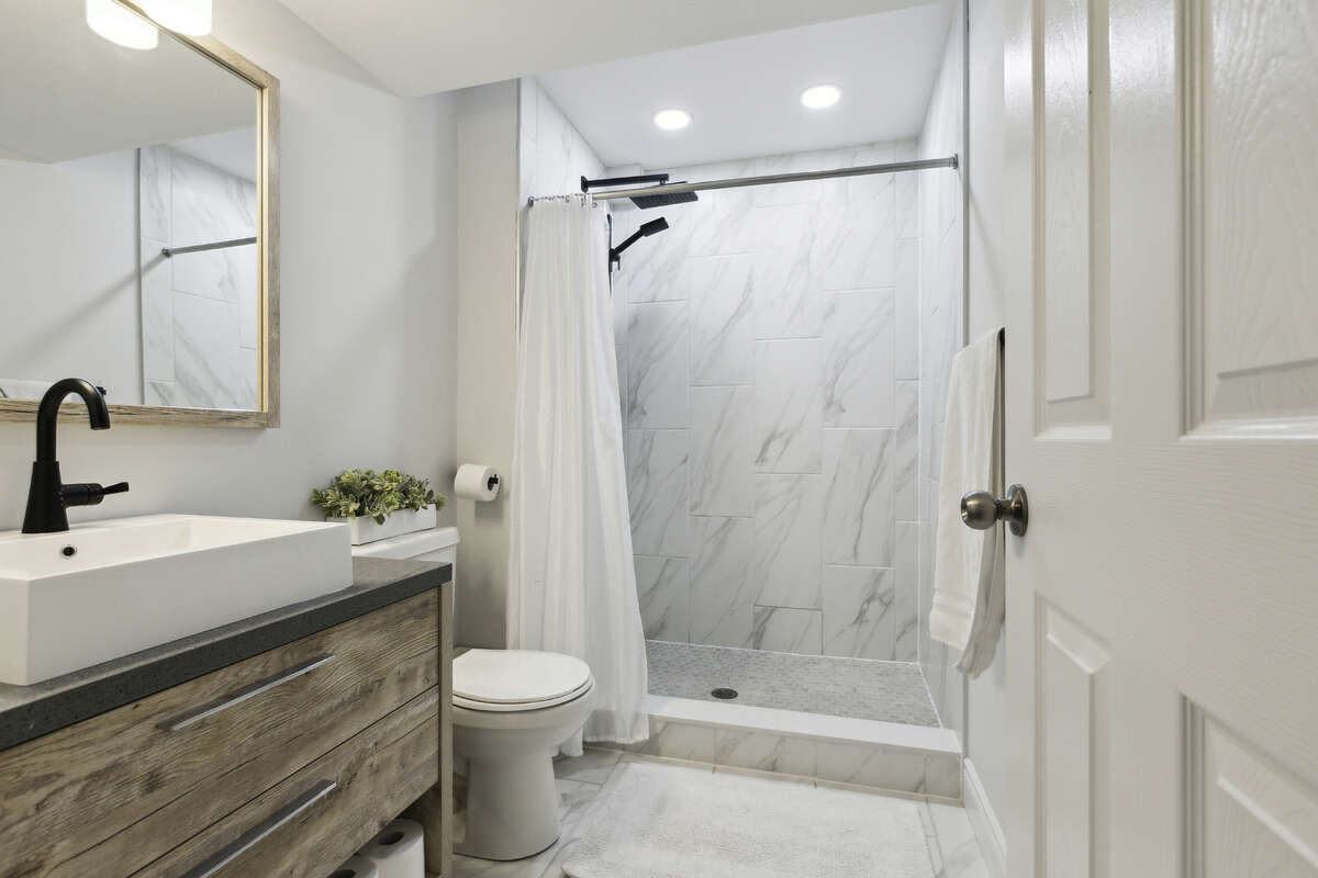 Added new bathroom with ceramic tile shower in basement