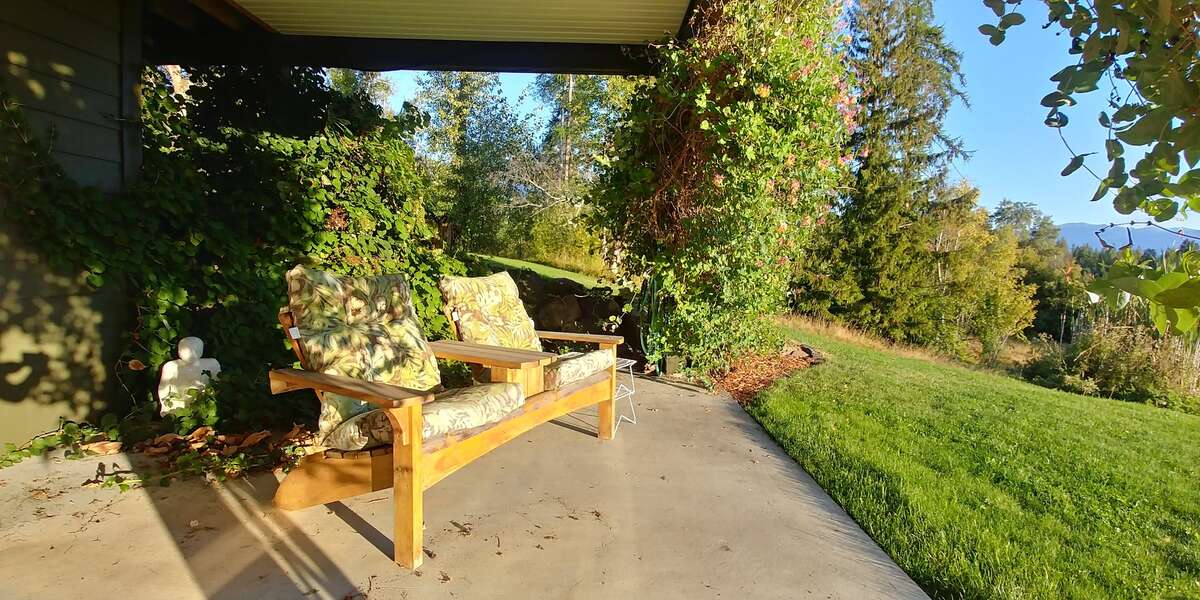 The deck is covered with duradeck, which makes for a lovely rainproof seating area below.