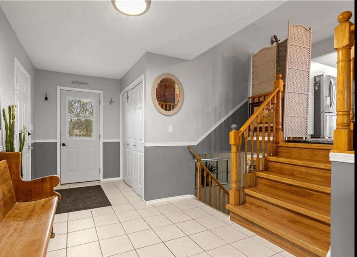 Foyer. Stairs upward to main level and down to lower level to 1 large b/r and self-contained apart.