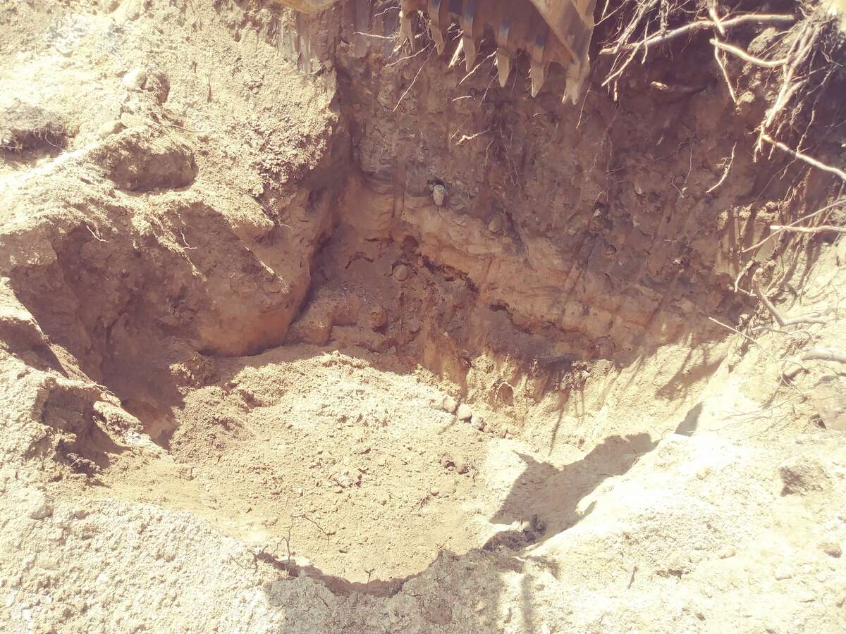 sevral test holes show sand under overburden of soil