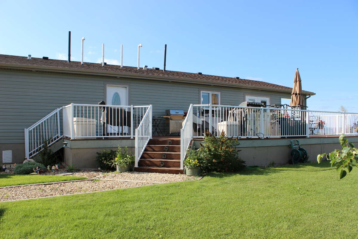 View of the deck with outdoor kitchen