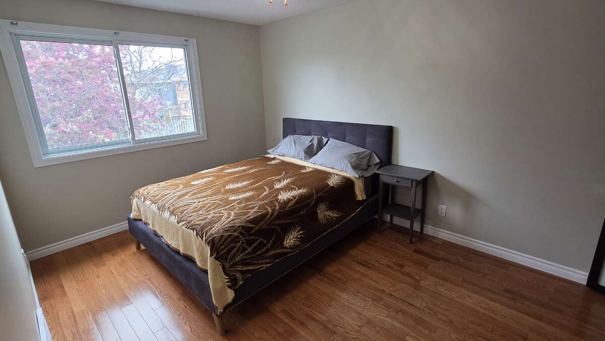 Spacious bedroom filled with natural light