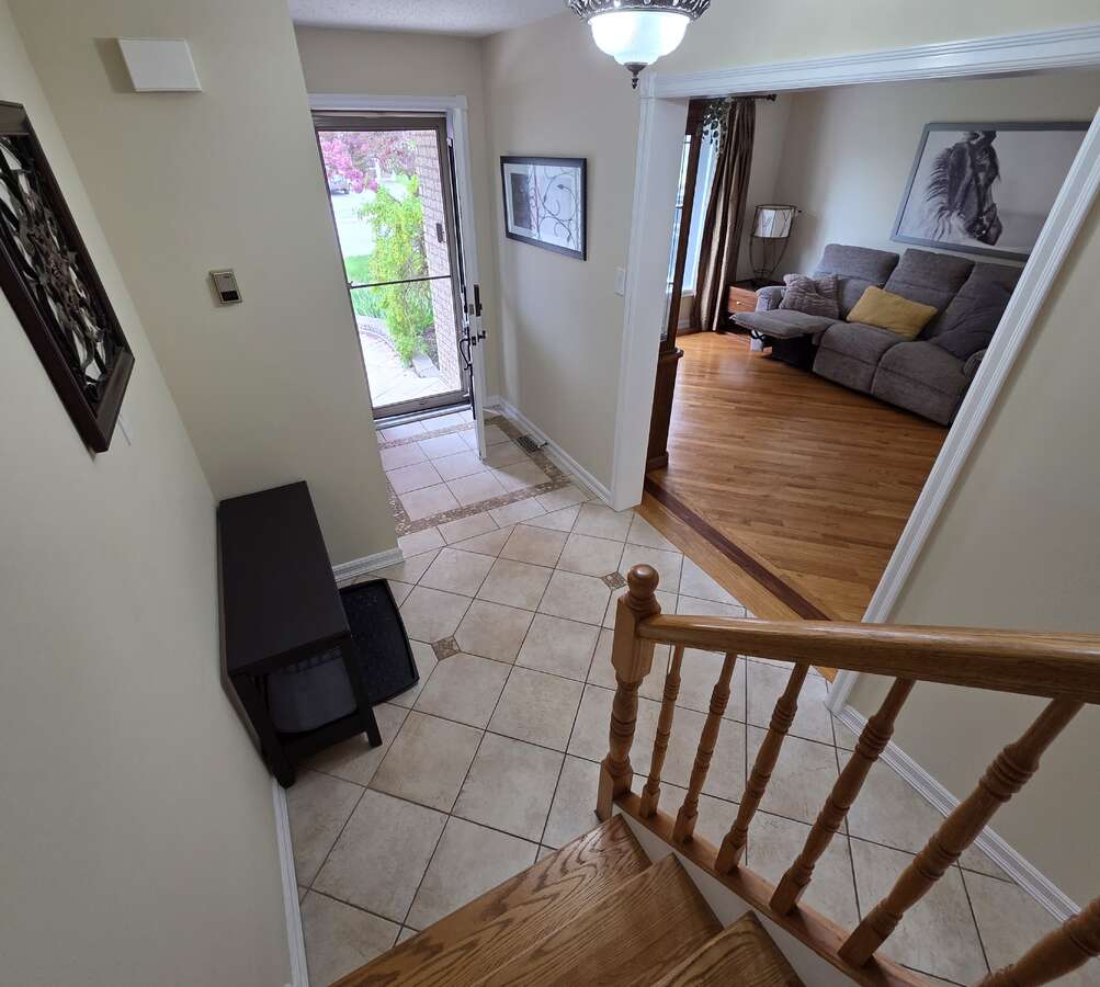 Bright foyer with tile entry opening to the main living area
