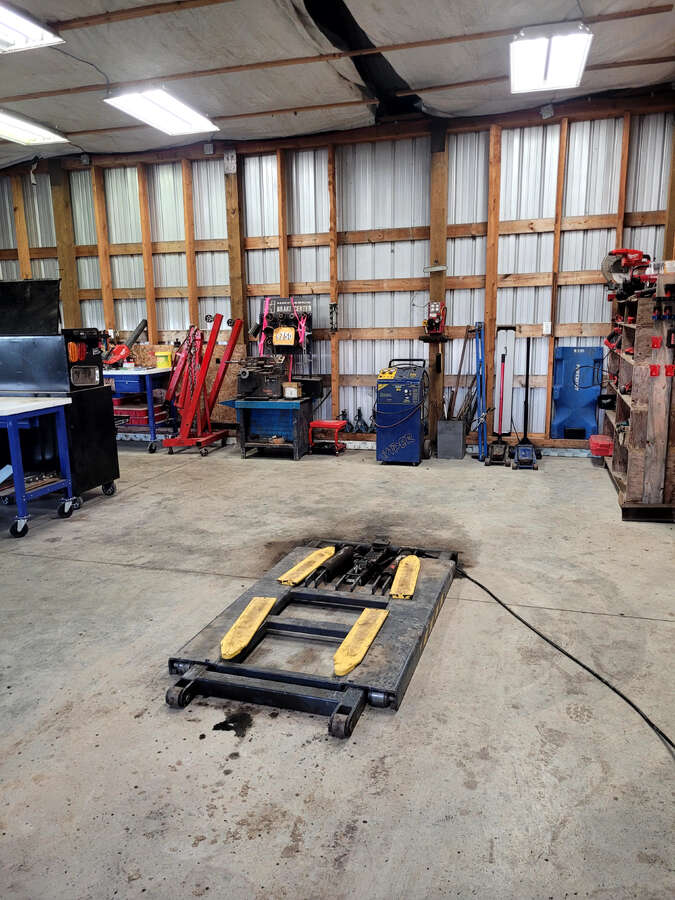 12 foot ceilings, fits full 1 ton truck with large canopy on back easily