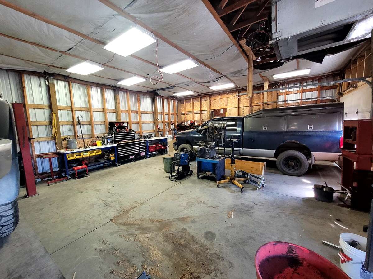 12 foot ceilings, fits full 1 ton truck with large canopy on back easily