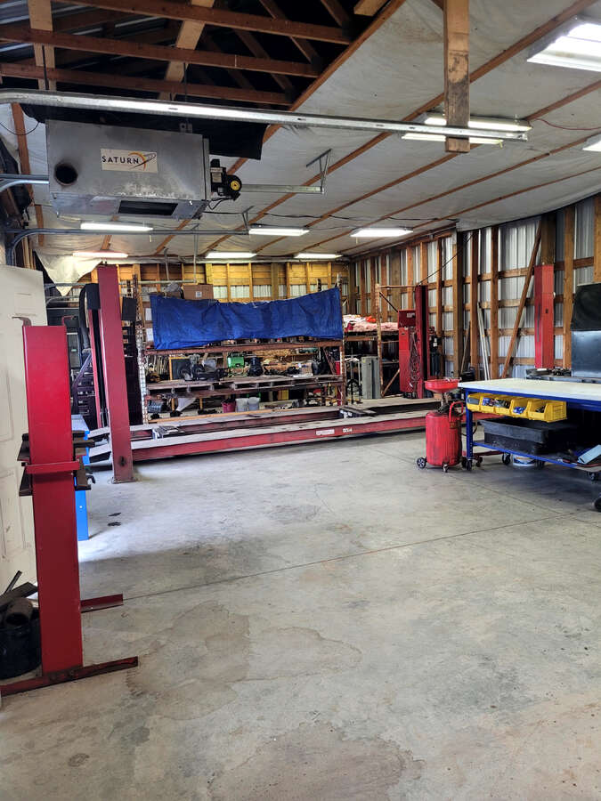 12 foot ceilings, fits full 1 ton truck with large canopy on back easily