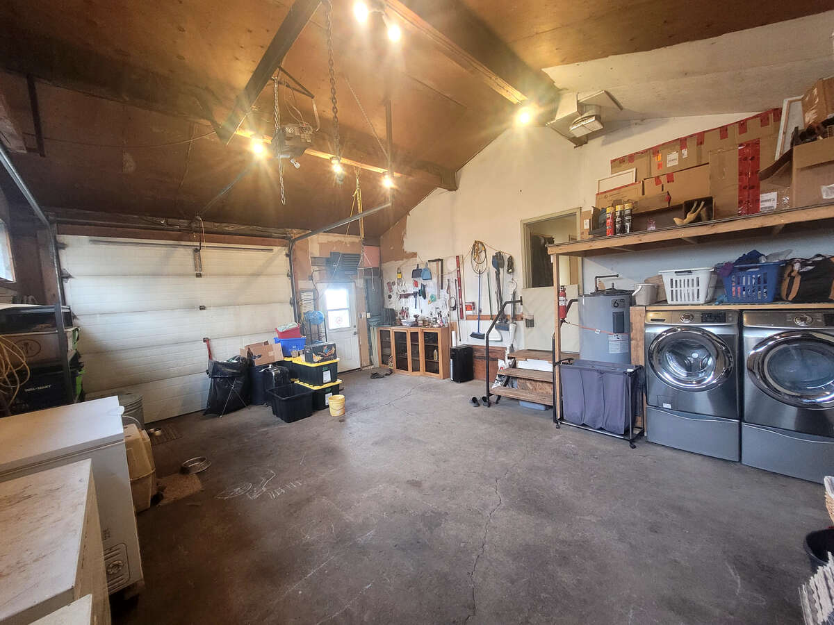attached garage, newer washer and dryer, concrete floor
