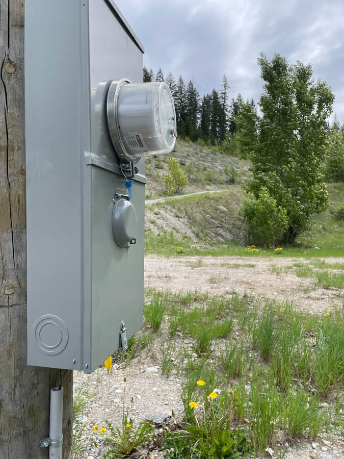 200-Amp service on lower plateau.  Driveway to upper plateau can be seen in the background.