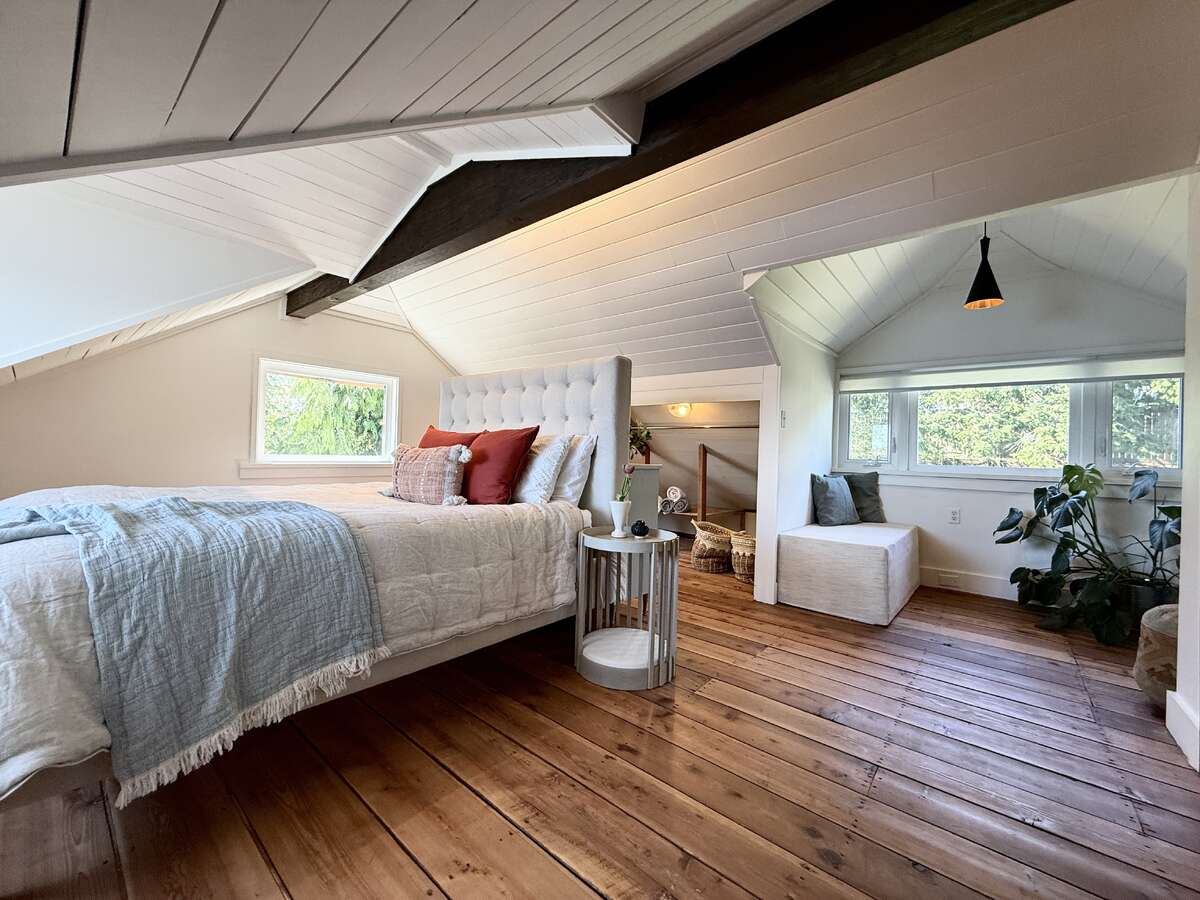 Loft bedroom + alcove changing space.