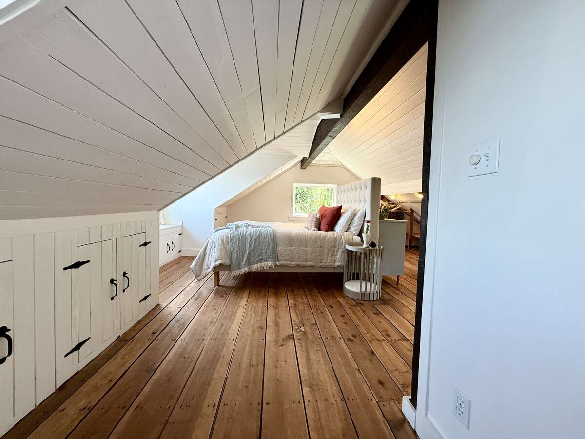 Huge, primary loft bedroom with stunning floor.