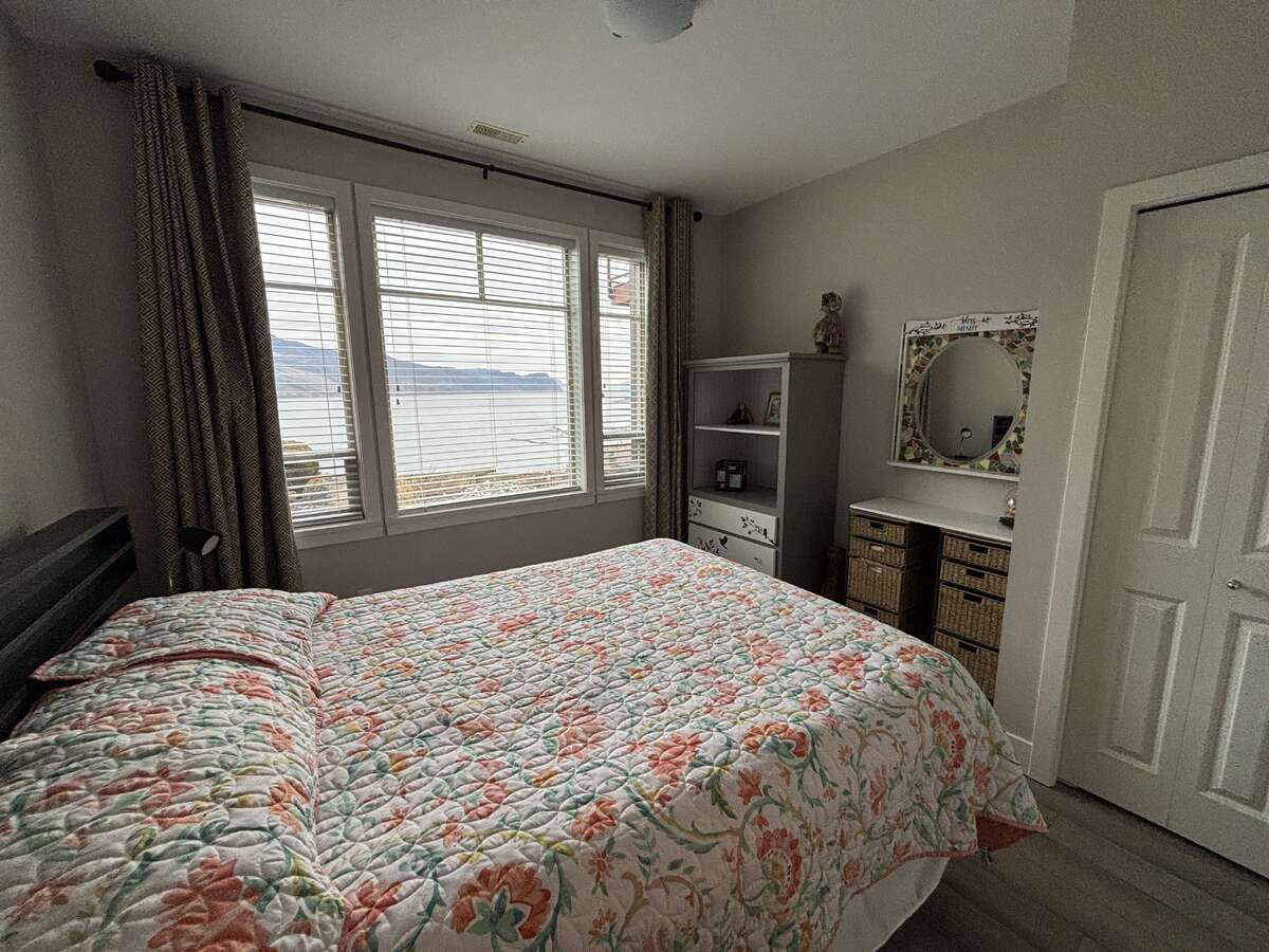 Lower level guest bedroom 180 degree lake view.