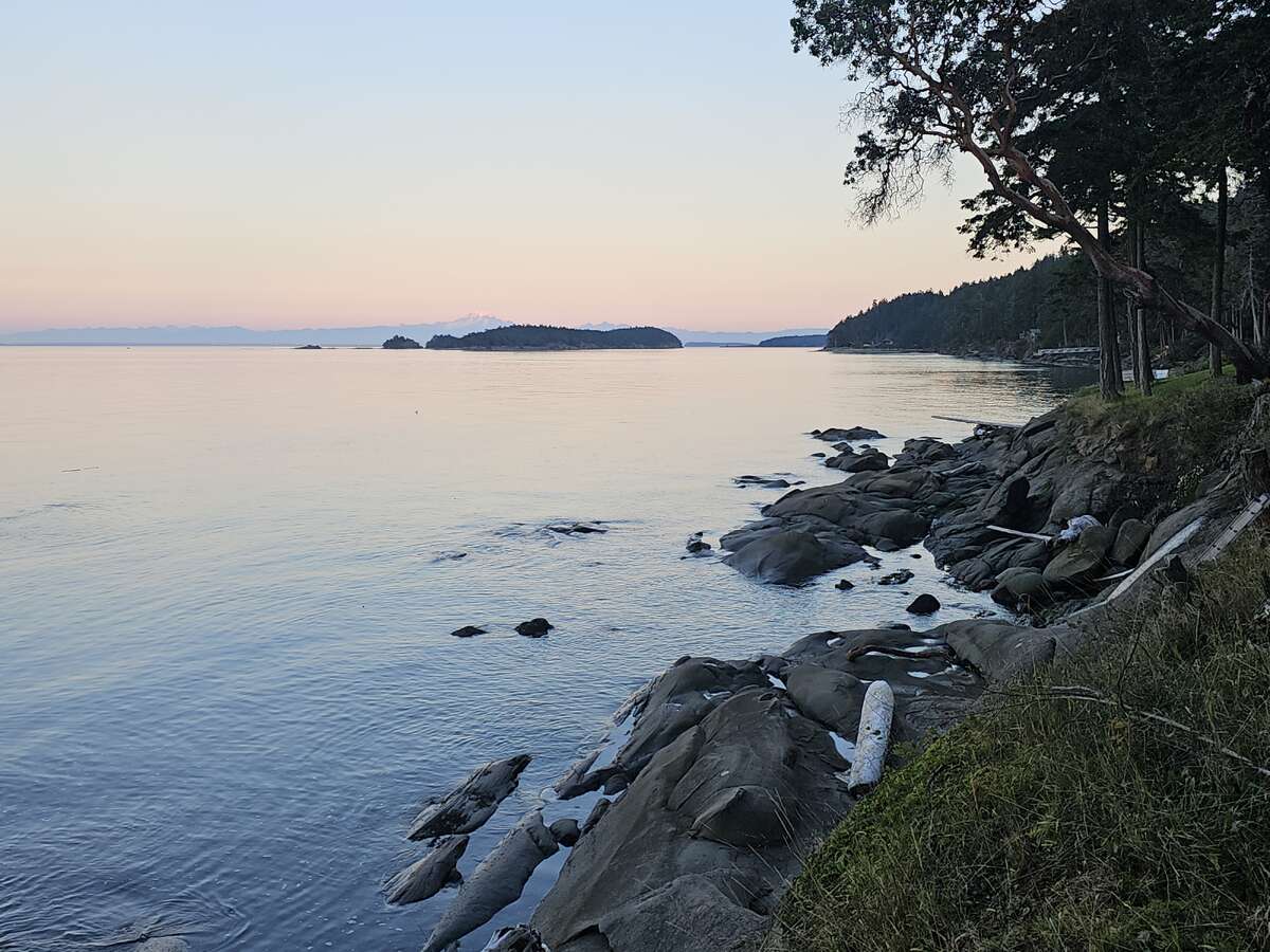 Sunset at low tide on beach.
