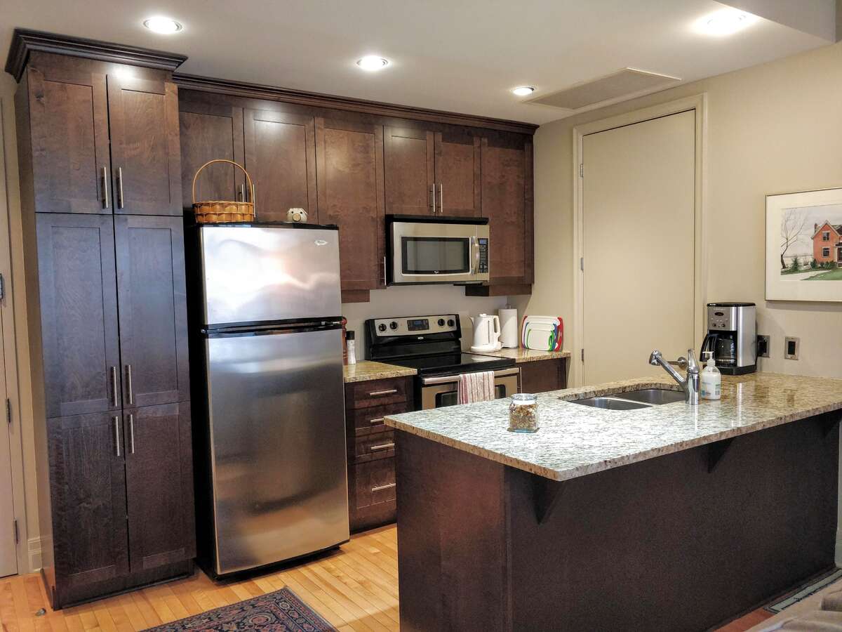 Kitchen with dishwasher, refrigerator, stove and microwave