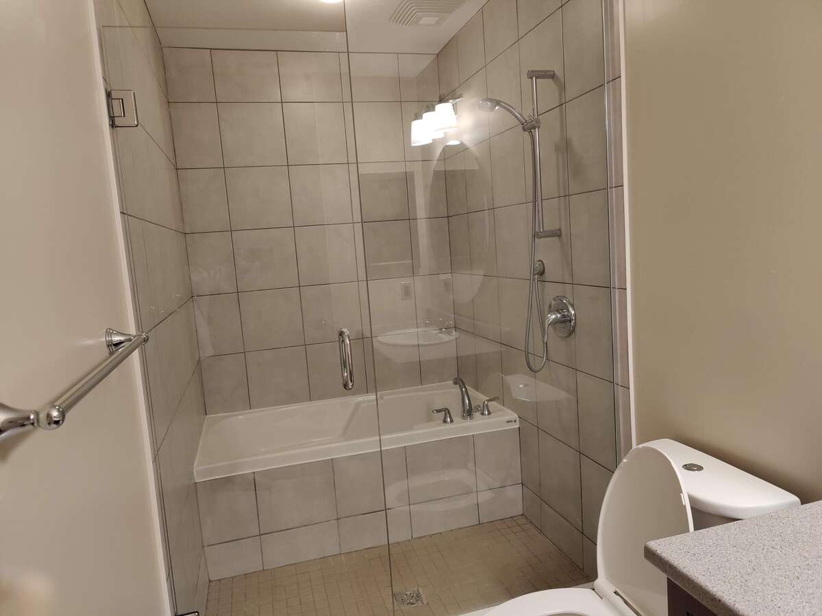 Ensuite bathroom with separate bath and shower area