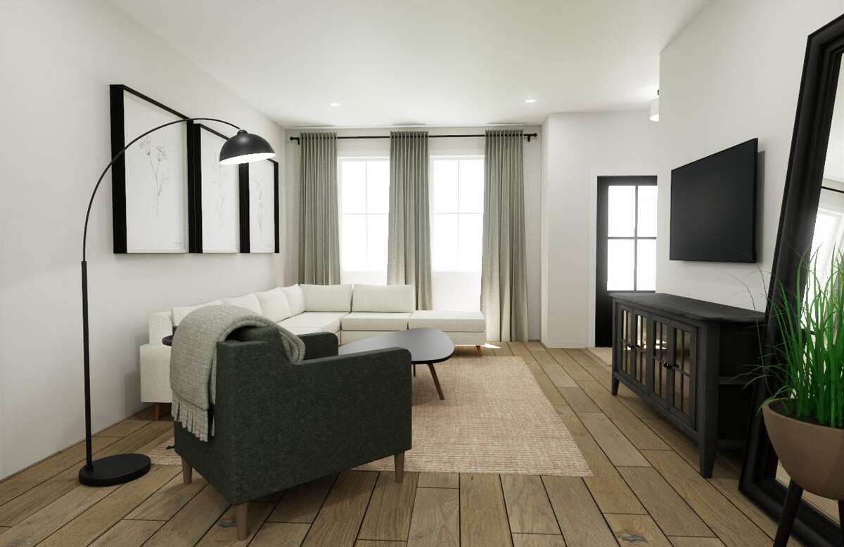 Large windows flood the living space with natural light.