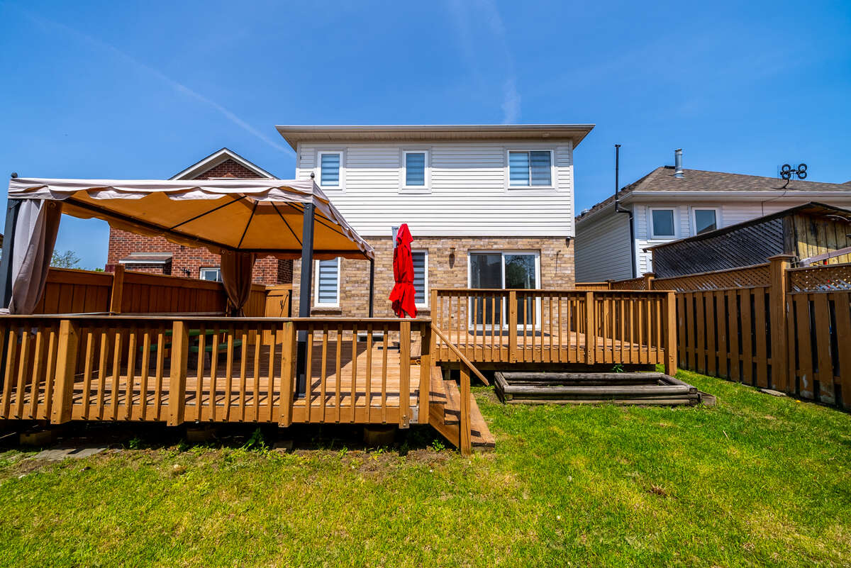 Backyard with 2 wooden decks