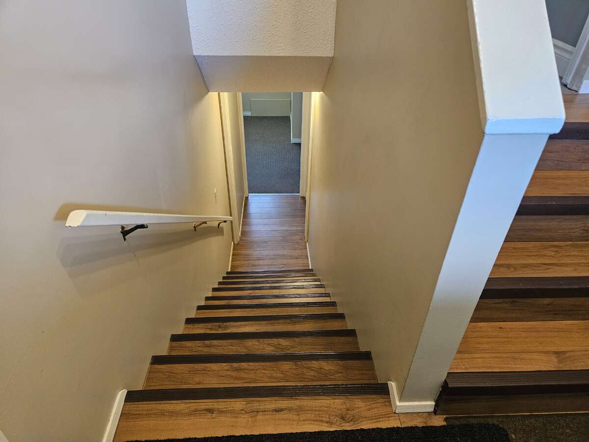 downstairs, laundry room on right at bottom