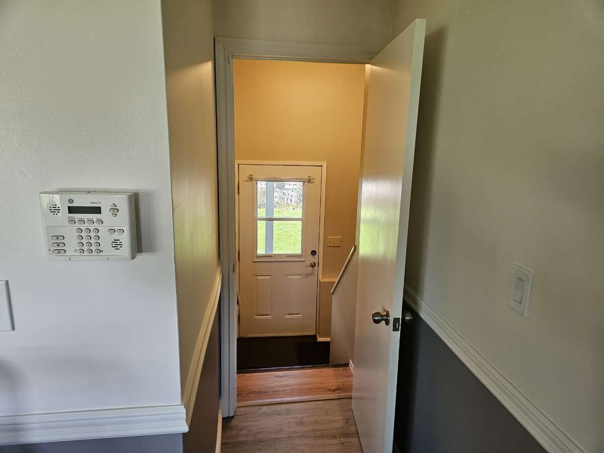 hallway to back door, kitchen is to the left