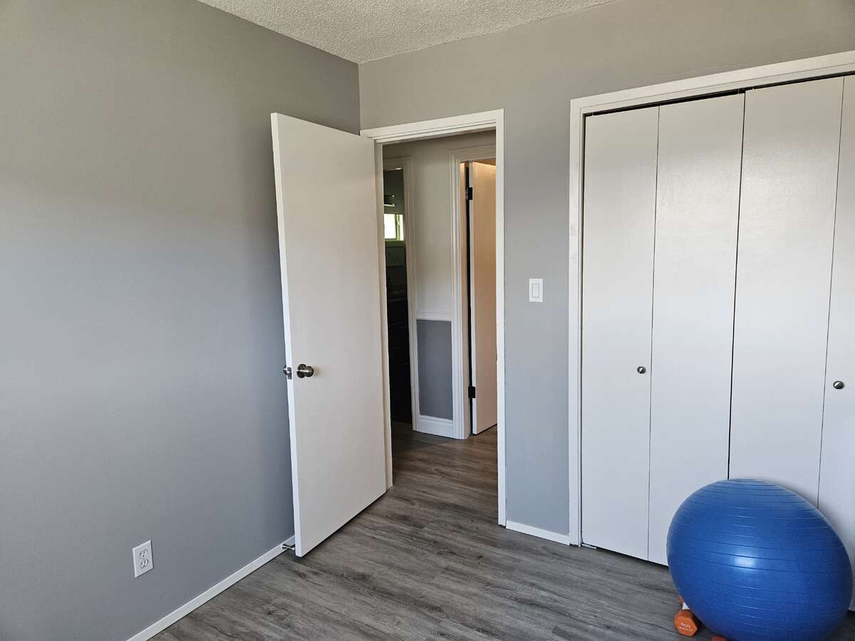 2nd bed looking to 3rd bed on right and bathroom on left