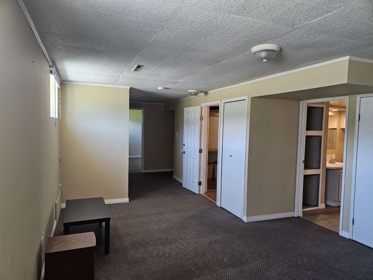 North end basement looking south, furnace and bedroom door on right just out of pic