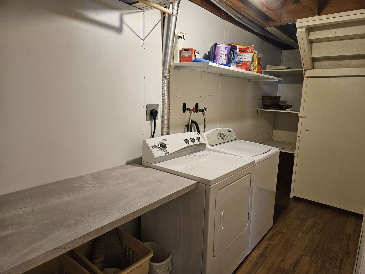 basement laundry room looking to back of house, cold storage door