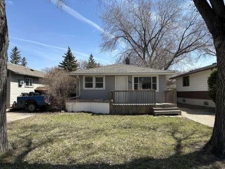 Land with Building(s) / Bungalow For Sale in Regina, SK - 2 bdrm, 1 bath (221 Smith Street)